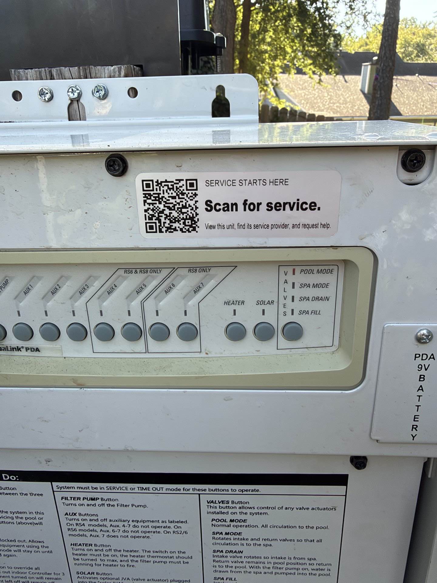 Tech Was Here QR service tag on a pool equipment controller, with the tag and controls visible
